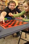 Steven helping Anya play Checkers
